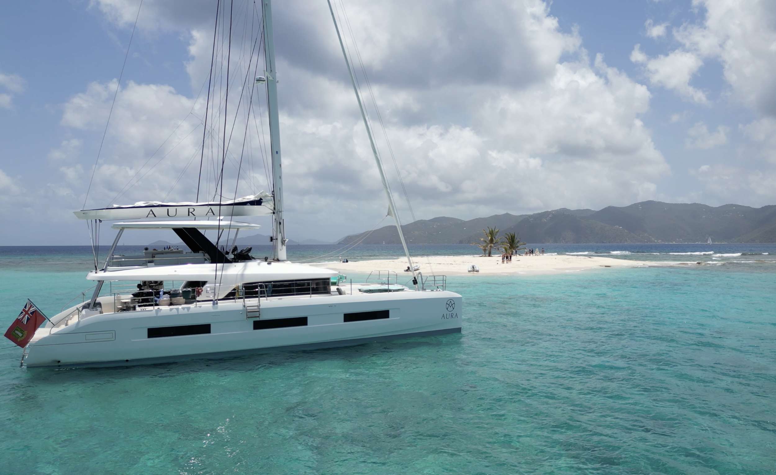Aura Yacht anchored off sandy spit in the BVI